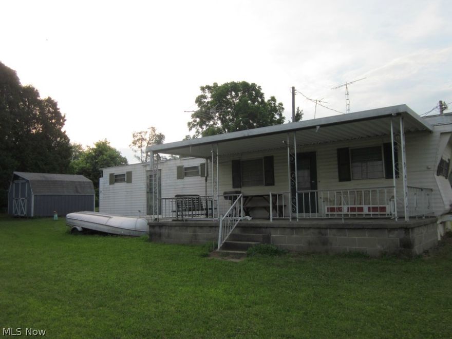 Nice lot on a paved road 1/2 mile to Seneca Lake Marina & Public boat ramps.  There is an older 2 bedroom mobile home  with 10 x 24 covered concrete porch.  The shed is negotiable.  The mobile home property tax is $18.00 per yr.. SELLING  AS IS.  $12.00 MWCD  Assessment.