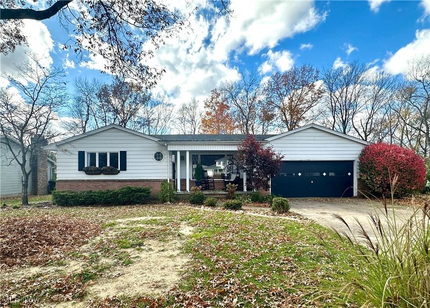 Discover the comfort & charm of this spacious ranch-style home perfectly situated on a half-acre lot in a quiet West Side neighborhood. Boasting an enviable location near Mill Creek Park, residents enjoy a short walk to the park's par-3 golf course, The Performing Arts Pavilion and all its natural beauty. Inside, the sundrenched living room features elegant wood flooring, while the dining area is enhanced by a slider that opens onto a patio, seamlessly blending indoor and outdoor living. The kitchen is a true standout showcasing a unique backsplash crafted from hundreds of pennies, adding a touch of whimsy and character to this culinary space. A convenient half-bath is tucked away adjacent to the cozy family room, which is highlighted by a lovely fireplace and a distinctive ceiling that adds a rustic flair. This area serves as a perfect retreat for relaxation or entertaining guests. A versatile bedroom or bonus room, accessible through stylish barn doors, offers a view of the beautiful backyard. Two additional bedrooms and an updated full bath ensure ample accommodation for loved ones and friends. The finished basement is a delightful surprise, providing an expansive area for games, hobbies or extra living space. A dedicated laundry room and storage area contribute to the home's functionality, keeping everything organized and easily accessible. The expansive backyard is a true oasis for leisure and enjoyment. Complete with a patio, firepit overlooking a tranquil creek, mature fruit trees and a variety of perennials, it provides both beauty and the potential for homegrown vegetables during the warmer months. The side yard serves as a secret garden, making this home feel even more special. Updates include: Roof, windows, baths, flooring, glass block windows, sewer line and backflow valve. This house radiates a relaxed and homey vibe, offering a comfortable and easy lifestyle that you'll love coming home to. Schedule your private tour today.