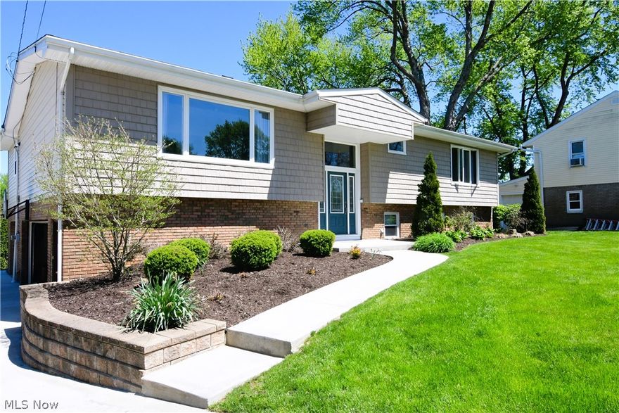 UPDATED 4 BDRM, 4 Full Bath, Mid-Century Modern 2-Level with Original Architectural Elements, Fabulous Curb Appeal and Beautiful Natural Lighting on both levels. This home is beautifully situated on a cul-de-sac setting with a sweeping drive and manicured lawn. Fabulous outdoor living areas feature a gorgeous patio and deck with excellent views of the expansive landscape. The updated interior offers original architectural elements with comfortable living spaces throughout. The impressive front entrance opens to a vaulted living and dining rooms with original beamed ceilings. Beautifully updated kitchen offers granite counters, custom cabinets, pantry, built-in planning desk and stainless-steel appliances. 1st floor media room is ideal for more informal relaxing and opens to the 1st floor deck. Private spaces include a beautiful primary suite with a luxurious bathroom and wall of built-in cabinetry.  Two additional bedrooms on this level.  The open staircase leading to the lower level d