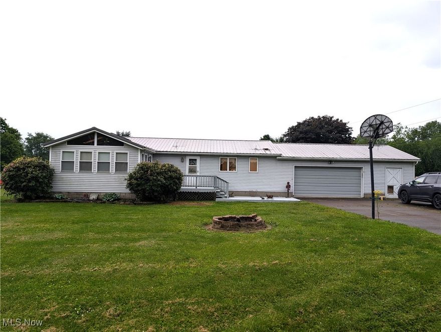 Check out this spacious 3-bedroom, 1 bathroom Ranch home on a flat lot.  This home has everything you need on one level.  There is a large eat-in kitchen that has plenty of cabinets, and a living room that walks out to the back porch.  There are 3 bedrooms and a bonus room.  The bonus room has a cathedral ceiling and could easily be used as a 4th bedroom or 2nd living room.    Outside has plenty of perks, you have a .34 acre lot, a large covered back porch, front porch and a large concrete driveway that gives plenty of room to park.  This property comes with a 2-car attached garage and a workshop area.  Schedule your showing today to see if this will be your next home.