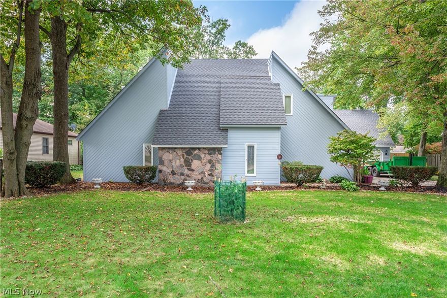 Unique large contemporary home with updates galore! 1st floor features foyer with marble flooring (2019) that extends into the beautiful fully remodeled and updated kitchen (2019) with plenty of cabinet and countertop space and all appliances staying. Luxury vinyl tile throughout the remainder of 1st floor which has  2 bedrooms, 1 full and 1 half bath, laundry room,  living room, formal dining room and family room with wood burning fireplace with blower and new sliding glass door (2021) leading out to large, private covered porch. 2nd floor features a master bedroom  with a large master bath, its own balcony and skylights, another bedroom and sizable bonus room. Exterior was completely painted 2021, roof 2020, concrete driveway 2021, new garage door 2021 on 2 car attached garage. Rear yard fenced with above ground pool