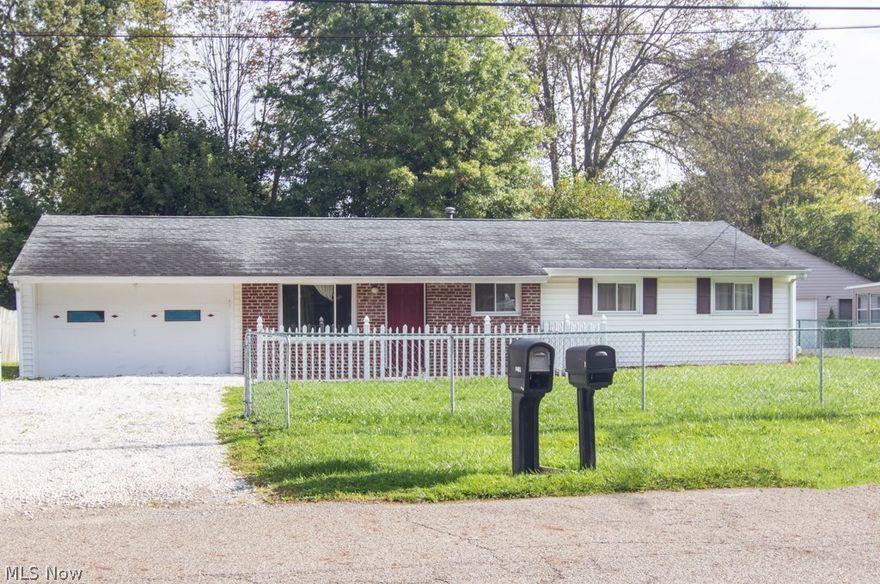 Looking for the perfect ranch? You found it! This 4 bed, 2 bath home features a tastefully updated interior and more room than meets the eye. Enjoy your favorite beverage as you relax on the new fenced in front patio that sits off the driveway leading to the attached two car garage. The garage features a bluetooth operation system for the modern convenience you’re looking for. Inside you will find beautiful brand new laminate flooring that flows from the spacious living room through the kitchen. Both the living room and kitchen boast tons of natural light. The kitchen was just updated in October 2021 and features new stainless steel appliances, granite countertops, and wood cabinets. Both bathrooms are updated and feature new tile flooring. You’ll love the convenience of the first floor laundry room that leads to the large fenced in  backyard. Each of the bedrooms offers a fresh coat of paint and newer carpeting. This ranch has everything you’re looking for and is just a short drive fr