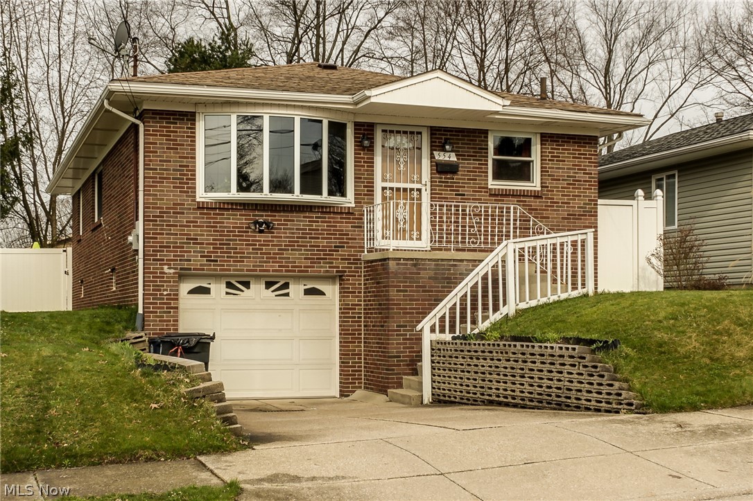 Dont miss this bright, sunny and meticulously clean raised ranch available in Ellet! Very spacious living room opens to an eat in kitchen with a breakfast bar, plenty of counter space and beautifully maintained cabinetry. Down the hall is a full bath and 3 bedrooms, all with very decent closet space! Stunning moulding throughout the first first floor. Downstairs is an additional full bath, and 2 finished spaces, let your imagination run wild! Surprisingly large attached 2 car tandem garage! Great back yard is inclosed with a lovely vinyl privacy fence. Home warranty included! This one is move in ready! Dont miss it!