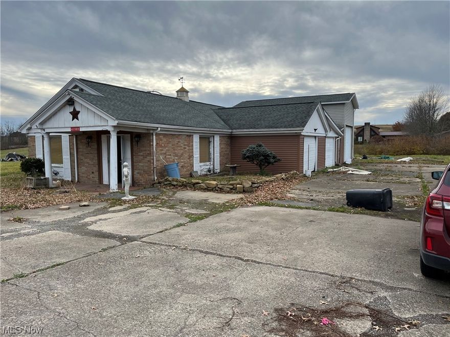 Former bank building converted into a 2 bedroom apartment with 3 bay garage attached. Apartment size is 1,956 sq. ft. & 3 bay garage is 1,070 sq. ft.
Level 1 acre lot. Property is being sold in "as is" condition.
Within 90 days after moving in, you must reach out to County Health Department to have Well Water and Septic Tank tested.