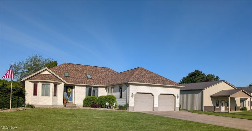 Spacious and versatile ranch home that features hardwood floors, updated interior, and deck with hot-tub.  The lower level offers 3 finished rooms, perfect for a rec space, home office, or potential 4th and 5th bedrooms. The master suite includes double sinks, a jetted tub, and direct access to the deck. Architectural highlights include cathedral and tray ceilings, skylights, bay windows, and glass block bsmt windows. The  40x70x14 insulated and heated outbuilding with two overhead doors is ideal for storage, hobbies, or a workshop. Enjoy the nearby public walking path and village reservoir just behind the property. Recent updates include a new roof in 2020, tub surround, interior paint, and central air in 2024.