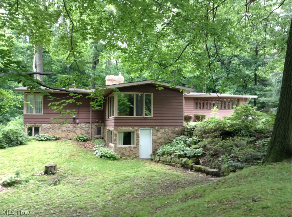 Private, wooded, and unique! If you are tired of looking at the same old style of house - take a look at this one! The spacious great room offers a wood burning fireplace and wonderful views. Or relax in the dining area and watch the deer in the woods behind your home. Three spacious bedrooms, a large kitchen with island, and an off set (perfect for an office area), all on the main floor. You also have a walk out basement, partially finished , waiting for your personal touch. If you have been looking for peace and quiet, look no further!
