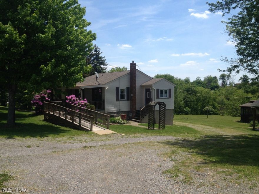 REDUCED!!! If you need space for all your outdoor toys, this is the place for you.. Large garage (32x40x13) built in 1992. Owner built it to fit his semi rig. It includes a full bath, air compressor, water, furnace, and attic half way across.  The yard is perfect for summer entertainment with it's pavilion & gazebo. The home is 4 BR one rm currently has washer/dryer hookup so you won't have to lug your laundry up steps. Wood flooring under carpet in the LR. Eat in kitchen, and nicely updated bath. Basement is partially finished with a fire place, walk out door, and fruit cellar.  Come look at it today!