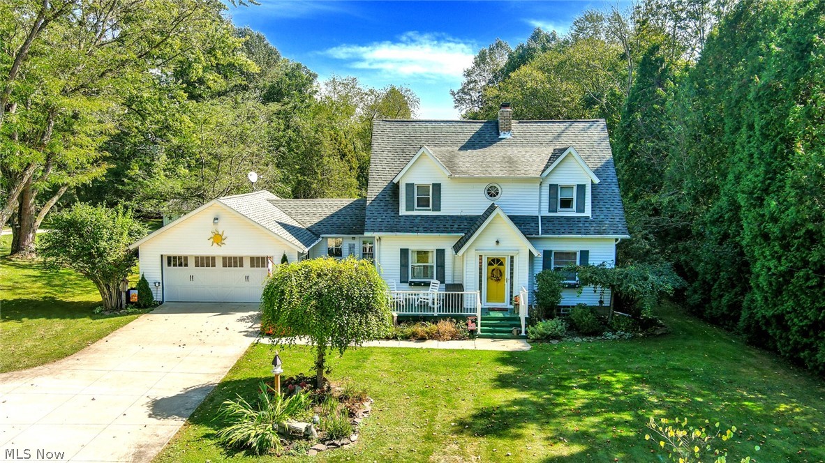 *Beautiful & Spacious Colonial In Norton Features 1,950 Sq. Ft Including 2-3 Bdrms & 1.5 Bathrms *2 CAR Attached Garage + 2.5 CAR Detached Garage!! *.85 Acres Backs Up To Trees W/No Neighbors Behind *Relax On An "L" Shaped Front Porch W/Vinyl Railings Enjoying Your Morning Coffee OR A Covered Back Porch W/Carpet Watching Kids Or Grandkids Play In The Yard *Updates Include: White Kitchen CABINETS W/Soft Close Drawers, LUXURY Plank Flooring, WATERPROOFED Basement, FURNACE And CENTRAL AIR, COMPLETELY Remodeled Full Bathrm W/TILE, Remodeled 1/2 Guest Bathrm, VINYL Windows & More! *Walk In To A Foyer W/Glass Door 2nd Entrance *LARGE Living Rm W/Built In White Wall To Wall Shelving, Gas FIREPLACE W/Tiled Hearth & Grey Modern Feature Wall, LUX Brown/Grey Rustic Flooring *Upgraded Blinds! *Elegant Formal Dining *The Kitchen Showcases White Cabinets W/Soft Close Drawers, LVP Grey Wide Plank Flooring, White Solid Surface Countertops, White SUBWAY TILE Backsplash, FULLY APPLIANCED *Eat In Bonus