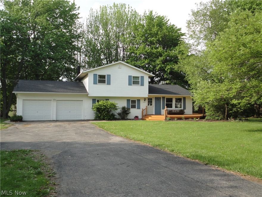 Gardeners delight with this attached multi-level styled green house on the back of the 1708 sq. ft. , 3-4 bedroom split-level house situated on 2.62 acres with a pond. Partially fenced yard for pets or kids to play and enjoy the approximately 1500 sq.ft. of  deck for entertaining. There is an enclosed rear porch to overlook the many garden features of this property. Within the last 7 years the home received: new roof, windows, doors, flooring in many rooms either replaced or refinished. Enjoy the lower family room leading to the enclosed porch and landscaped yard. The kitchen opens directly to the dining area with access to the deck for entertaining. Paved parking with turnaround area, storage shed and fenced garden area. The pond is located to rear of property with outdoor fire pit, there is additional water source for watering gardens or application of waterfall to pond. Minutes from Midview Schools, expressway system and more. Home Warranty included for one year from date of purchas
