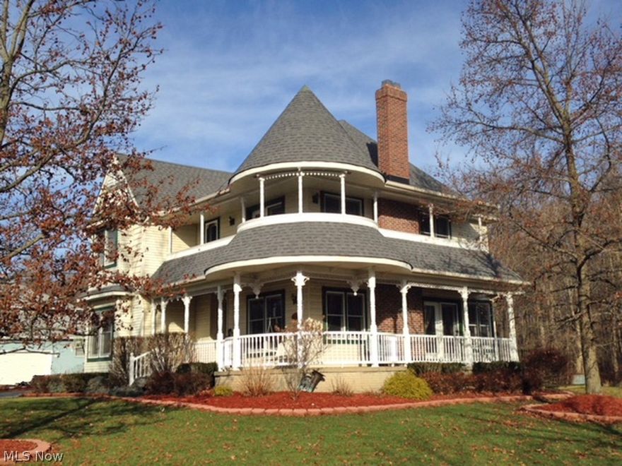 Truly one of a kind!  Don’t miss this impressive, custom-built, Victorian style colonial situated on a private, park-like setting!  Featuring a dramatic wrap-around front porch (top & bottom), a charming & spacious parlor w/a wood burning frplc & solid oak mantle, a formal dining room, and a morning room located off the kitchen.  The kitchen includes granite counter tops, tile back splash, oak cabinets, an island, newly installed Stanek window over the sink, and all appliances.  Situated off the morning room is a large laundry room that leads the 3-car garage, a guest bath, and a 3-season sunroom overlooking the gorgeous yard with breathtaking views of the deck & patio areas.  The 2nd level offers a gracious master suite with French doors that lead to the wrap-around porch, a gas frplc w/a solid oak mantle, a walk-in closet, vaulted ceiling, and a glamour bath with a Jacuzzi tub, & newly installed shower.  There are 2 additional bedrooms, a full bath, and a loft area on this floor.  Th
