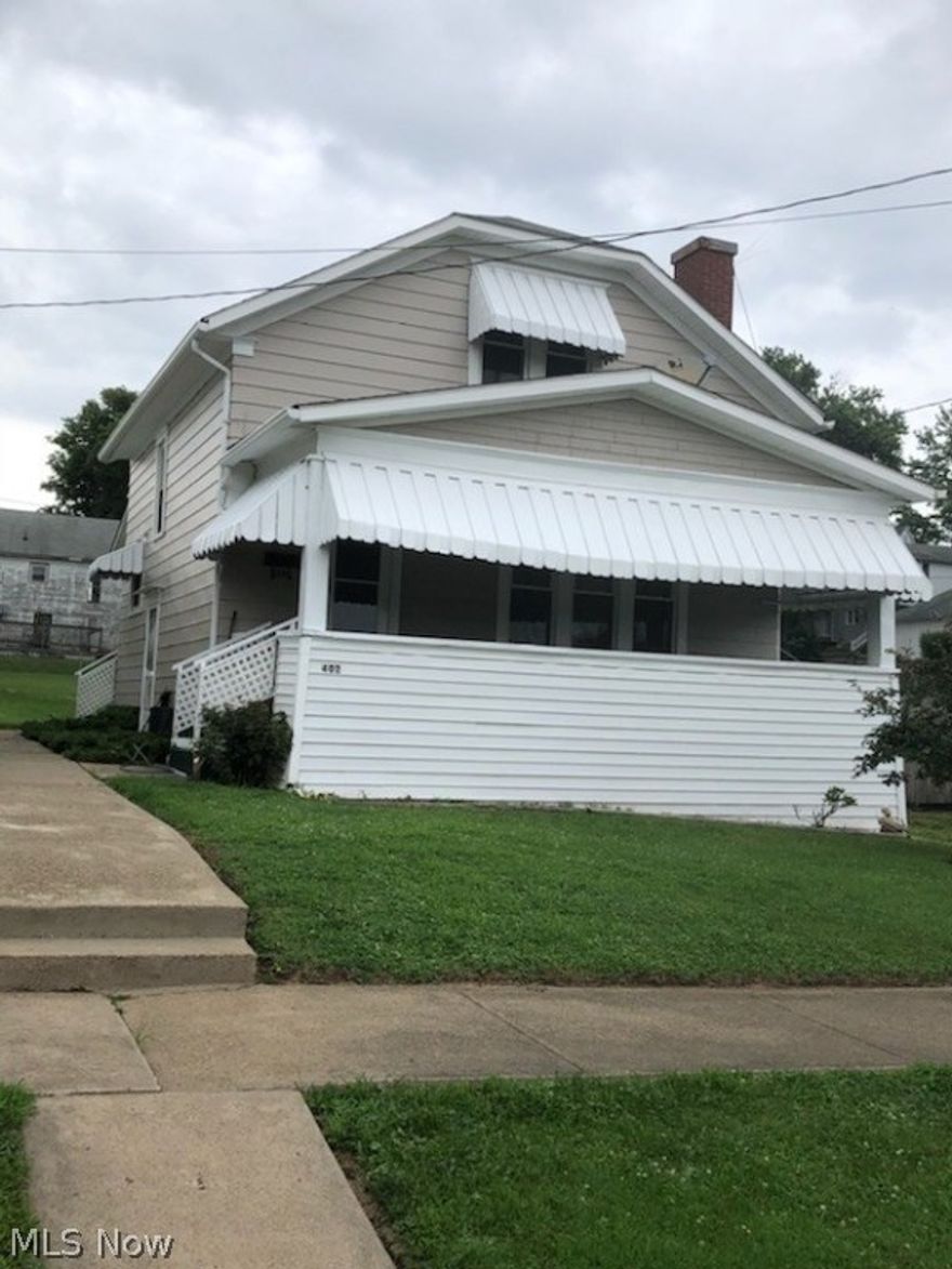 This delightful 1 1/2 story home offers a large front porch, 2 bedrooms, and 1 baths. Enjoy the ornamental fire place with build ins and cute nook in the living room. Spacious dining room offers double windows. This home has character, lovely front porch, and separate garage and being sold "As Is" due to being rental property but now being sold as residence. Spacious, detached 1 car garage. Electric has been updated.Seller will give 3% towards buyers closing fees THIS HOME HAS BEEN FRESHLY PAINTED on the exterior! Sunroom off kitchen has been used as an xtra bedroom. There is a sink and shower in the basement area. THIS HOUSE WAS PREVIOUSLY A RENTAL PROPERTY. BEING SOLD “AS IS” WITH RIGHT TO ALL INSPECTIONS. May be used as a rental while buyer is financing. Inquire with listing agent. Can be lease to own.