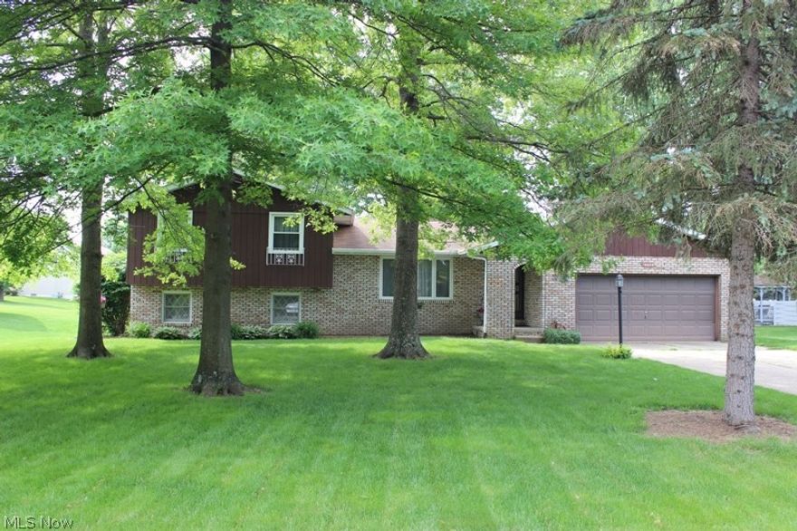 A great value and lots of space is offered in this 4-level Split that includes 4 Bedrooms, 2-1/2 baths, and three separate Living areas to enjoy. The spacious Living Room is open into the Dining Room, and the Kitchen is open to the Family Room with wood burning fireplace. Sliding doors off the Family Room leads to a nice deck, backyard, and new large storage shed. A few steps down to the Recreation Room, complete with built-in bar, and also where the 4th Bedroom and 1/2 bath are located. Full basement for plenty of storage as well as additional crawl space.  Upstairs, three more Bedrooms, including a Master Bedroom with it's own private Master Bathroom. Pretty original character with nice crown molding and touches. Recent improvements include new Vinyl floor in Bathrooms, updated lighting fixtures, fresh paint and cosmetic updates. Great location close to GlenOak Community Campus, located in the Hunters Ridge Neighborhood. This home is priced well below most others in this area, and ha