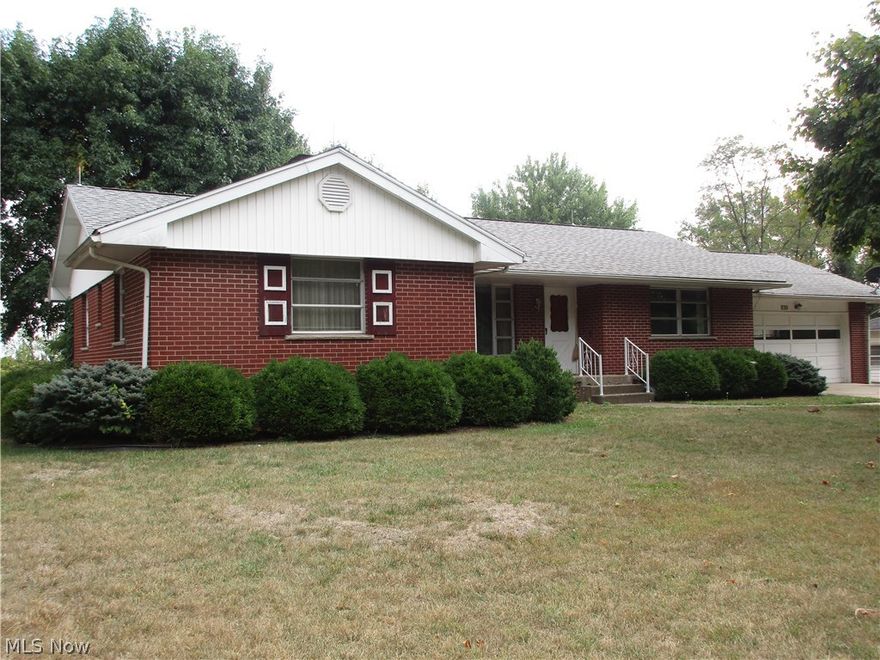 Nice brick home on a beautiful lot with woods as a backdrop.  Huge living room with stone fireplace, two spacious bedrooms on first floor.  Kitchen with den/family room.  Dining room has access to covered back porch with lots of privacy.  Newer boiler and newer central air.  Lower level has spacious family room, bedroom, full bath and full kitchen with laundry area.  Separate outside entrance to this perfect mother in law/teenager suite.  Also has separate parking pad.  Great location with easy access to shopping, restaurants, schools and more.   M913 KL