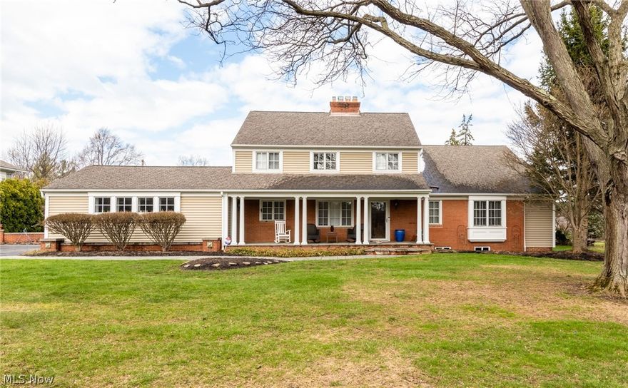 Impeccable presentation of quality and craftsmanship defines this one-of-a-kind updated Colonial set on a private, one-acre lot. A welcoming Bluestone front porch leads into an open and airy Dining Room featuring a brick fireplace and mantel, built-in Cherry cabinetry with wet bar, Oak floors, and room for a sizable dining set plus conversation groupings, ideal for entertaining. A set of doors in the Dining Room open to a side porch. The oversized Living/Family Room offers newer carpeting (2022), a vaulted and beamed ceiling, wall of windows with sweeping views of the grounds, a corner fireplace, and custom built-in bookcases. An entry foyer off the Living/Family Room gives access to the paver patio and the private, park-like backyard complete with an invisible fence. The remarkable, updated gourmet eat-in Kitchen will inspire any home chef, offering Maple floors, Quartz counters, high-end KitchenAid appliances, and abundant Shaker-style ceiling height cabinets. A walk-in Pantry is off the Kitchen. A book-lined hallway leads to the first-floor Owner’s Wing, including a Library with built-in shelves and storage. The serene Primary Suite with luxurious spa bath features dual vanities, an oversized, tiled step-in shower, and expansive walk-in closet with numerous built-ins. A first-floor Guest Bedroom with adjacent full bath and convenient Laundry Room complete the main level. The second floor offers two additional spacious Bedrooms, one with an en-suite full bath and the other with adjacent full bath in the hall. The finished Lower Level provides a generous Recreation Room and additional storage. Additional highlights include some updated fixtures and accent lighting throughout (2023), an attached two-car side-load garage and dual-zone HVAC with newer components. Don’t miss this elegant and truly special residence!