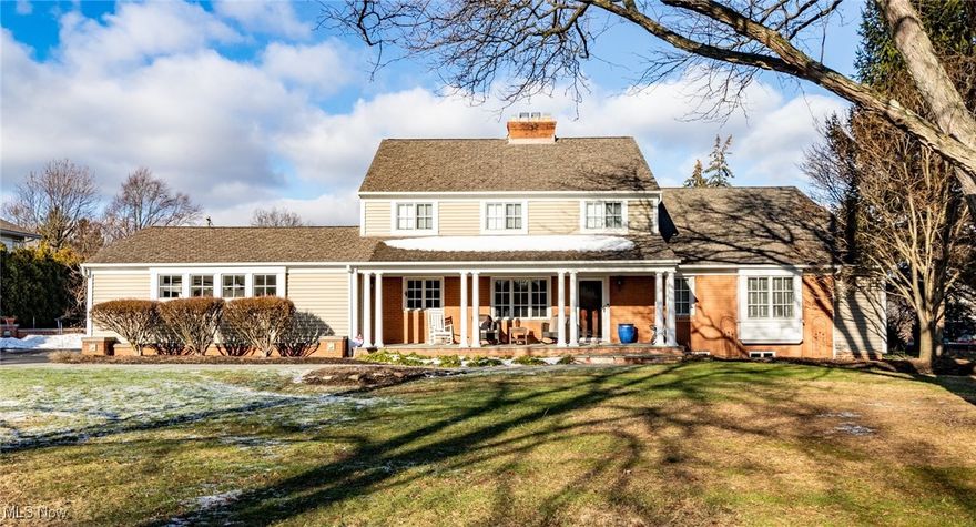 Impeccable presentation of quality and craftsmanship defines this one-of-a-kind updated Colonial set on a private, one-acre lot. A welcoming Bluestone front porch leads into an open and airy Dining Room featuring a brick fireplace and mantel, built-in Cherry cabinetry with wet bar, Oak floors, and room for a sizable dining set plus conversation groupings, ideal for entertaining. A set of doors in the Dining Room open to a side porch. The oversized Living/Family Room offers newer carpeting (2022), a vaulted and beamed ceiling, wall of windows with sweeping views of the grounds, a corner fireplace, and custom built-in bookcases. An entry foyer off the Living/Family Room gives access to the paver patio and the private, park-like backyard complete with an invisible fence. The remarkable, updated gourmet eat-in Kitchen will inspire any home chef, offering Maple floors, Quartz counters, high-end KitchenAid appliances, and abundant Shaker-style ceiling height cabinets. A walk-in Pantry is off the Kitchen. A book-lined hallway leads to the first-floor Owner’s Wing, including a Library with built-in shelves and storage. The serene Primary Suite with luxurious spa bath features dual vanities, an oversized, tiled step-in shower, and expansive walk-in closet with numerous built-ins. A first-floor Guest Bedroom with adjacent full bath and convenient Laundry Room complete the main level. The second floor offers two additional spacious Bedrooms, one with an en-suite full bath and the other with adjacent full bath in the hall. The finished Lower Level provides a generous Recreation Room and additional storage. Additional highlights include some updated fixtures and accent lighting throughout (2023), an attached two-car side-load garage and dual-zone HVAC with newer components. Don’t miss this elegant and truly special residence!