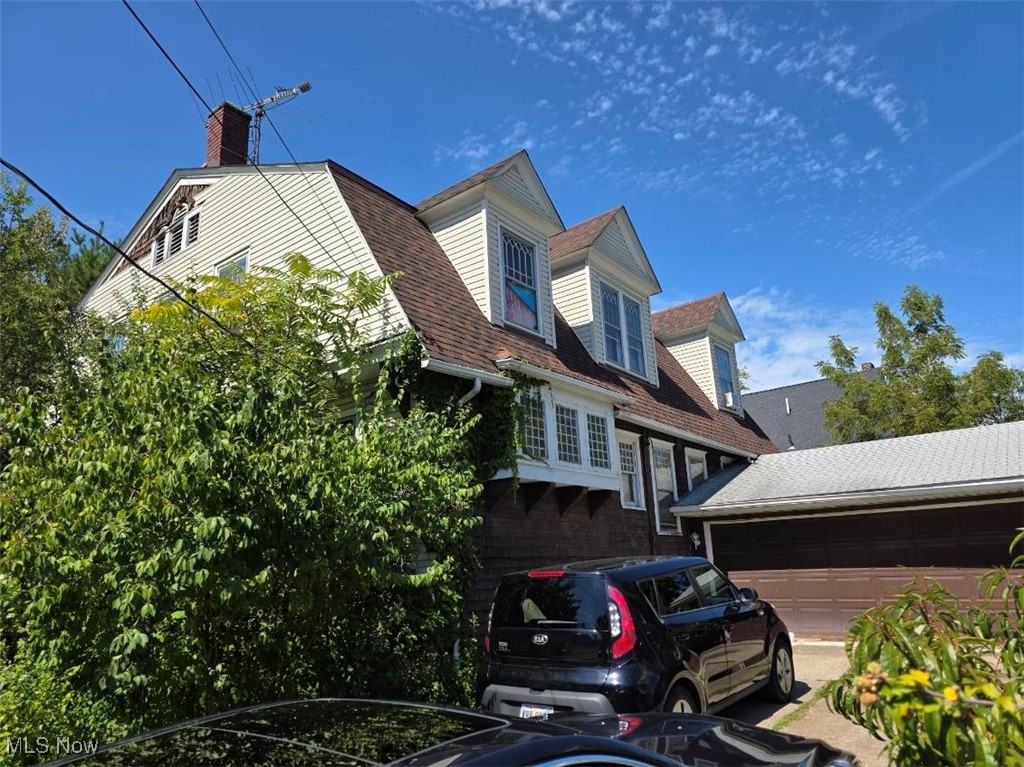 Attention investors or owner-occupied buyers! Here is a magnificent opportunity to restore a once-prestigious masterpiece into a true showpiece. Located within walking distance to the lake and marina, this massive home offers incredible space, character, and details that are rarely found. The oversized pillared front porch makes a bold first impression, while the fenced lot and 2-car garage add convenience. The exterior has updated dimensional shingles, with a mix of wood and vinyl siding. Inside, an inviting foyer welcomes you with soaring 10-foot ceilings, decorative beams, and abundant natural light from large windows. A custom stone fireplace adds warmth and character to the spacious living areas. The kitchen provides plenty of room for any chef, complemented by a large formal dining room perfect for holiday gatherings and a massive family room designed to accommodate everyone. A dramatic spindled staircase leads upstairs to four oversized very cool bedrooms, including a walk-in closet, and two bedrooms that feature unique walk-out balconies. The full daylight basement with large windows provides endless possibilities. New H20 tank. While this home needs cosmetic updates and mechanical work (boiler does not function), the bones and character are already in place to make it exceptional again. Being sold strictly as-is—cash or rehab loan buyers only. No owner financing, no wholesalers. Serious, qualified buyers only, please.