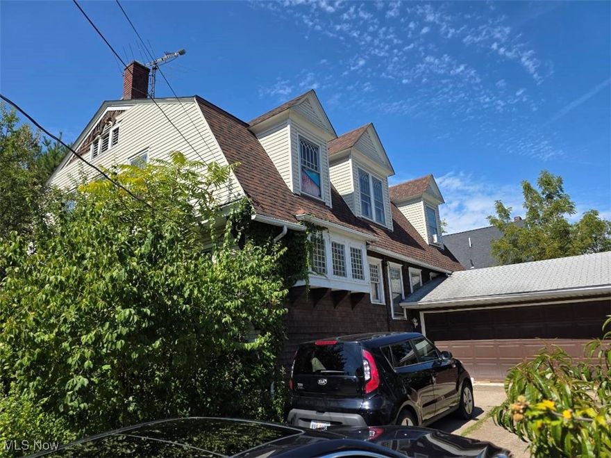 Attention investors or owner-occupied buyers! Here is a magnificent opportunity to restore a once-prestigious masterpiece into a true showpiece. Located within walking distance to the lake and marina, this massive home offers incredible space, character, and details that are rarely found. The oversized pillared front porch makes a bold first impression, while the fenced lot and 2-car garage add convenience. The exterior has updated dimensional shingles, with a mix of wood and vinyl siding. Inside, an inviting foyer welcomes you with soaring 10-foot ceilings, decorative beams, and abundant natural light from large windows. A custom stone fireplace adds warmth and character to the spacious living areas. The kitchen provides plenty of room for any chef, complemented by a large formal dining room perfect for holiday gatherings and a massive family room designed to accommodate everyone. A dramatic spindled staircase leads upstairs to four oversized very cool bedrooms, including a walk-in closet, and two bedrooms that feature unique walk-out balconies. The full daylight basement with large windows provides endless possibilities. New H20 tank. While this home needs cosmetic updates and mechanical work (boiler does not function), the bones and character are already in place to make it exceptional again. Being sold strictly as-is—cash or rehab loan buyers only. No owner financing, no wholesalers. Serious, qualified buyers only, please.