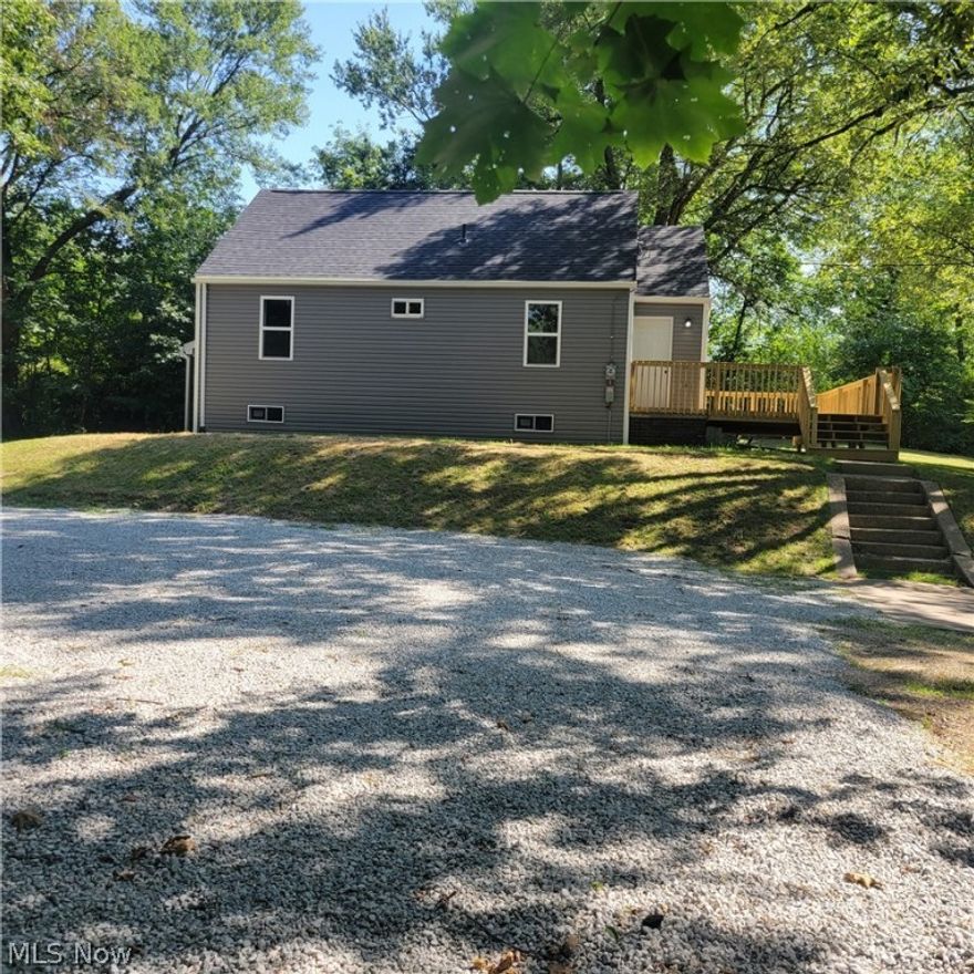 Located on just under an acre of land is a completely remodeled 2BR/1BA home residing a very secluded location.  First floor features include kitchen, dining area, living room, 2 bedrooms, and a full bath.  The second level has all new floor, drywall, carpet and paint for your 3 rd. bedroom .  There is a new gas furnace and hot water heater in the basement, a new submersible pump in the water well, and a new central air unit. This property has a new kitchen, bathroom, paint, flooring, siding, windows, roof, spouting , plumbing and some of the wiring, and front deck. Storage shed in the back of property with new metal siding.  Large all gravel parking area.