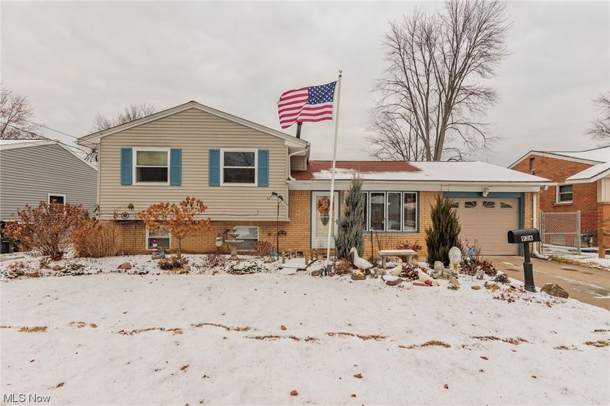 3 bedroom 1 1/2 bath split level home with interior cedar accents and a large woodburning stove.  Upon arriving you will notice the front door with a leaded glass look window, in the front living room there is a large bow window flooding the room with natural light and a cedar ceiling.  The cedar ceiling and accent wall continue in the eat-in kitchen.  The dining area has a ceiling fan and a large slider door leading to the backyard patio. The kitchen has wood cabinetry, luxury vinyl plank, and a double sink. The full bath features a large vanity with double sinks. The master bedroom has original hardwood flooring, a ceiling fan, and 2 large closets. The second and third bedroom has original hardwood flooring and a ceiling fan.  The walk out lower level which is being used as another bedroom can be used as a family or flex room.  Enjoy the spacious fenced in backyard for family gatherings!  Close to shopping centers, restaurants, and freeways ( I-90 and I-480).   Schedule your private showing today!