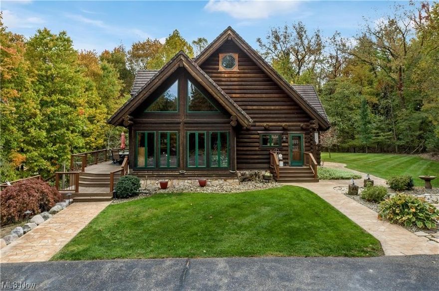 If you're looking for your own private oasis to escape to, this is it. This 25-acre property has it all from a beautiful Artisan Built log cabin with 4-bedrooms, 4.5 bath, a 3-car detached garage with potential for an apartment, and stocked ponds, to a large barn and 5 acres of pasture field. The log cabin is move-in ready and is inviting to everyone with its wood log walls, high ceilings and rustic beams. Entering the cabin, you will find an open foyer leading to the great room with large windows brightening the entire space, a living room and dining room surrounded by windows. The beautiful Schrock's kitchen is a centerpiece of the home, providing the perfect space for cooking entertaining and gathering with loved ones. On the other side of the home, there is a master bedroom, walk-in closet and master bath with double vanities, a walk-in shower and a bathtub. Finishing the main floor is a guest bath and a laundry room. The second story is just as impressive as the first with another