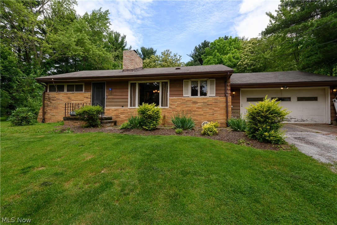 Wow! Check out this amazing Ranch home located in the Norton CSD. This gorgeous 2 bedroom, 1 bath home as been wonderfully maintained and is ready for a new owner. Situated on a 1.39 acre lot, the location could NOT be better. The home sits up away from the road, but also offers a HUGE backyard with scenic and wooded views. Walk in the front door and you are greeted by the warm embrace of the spacious living room, complete with an all brick fireplace. Continue your way around the fireplace and you come to the lovely dining room area. It is conveniently located off the kitchen and would be perfect for those family meals. The wonderfulness that is this home continues on into the sizable kitchen which has been freshly painted! This home also features a 2 car attached garage as well as an awesome covered back patio which would be great for those that love to entertain and enjoy those Summer days and evenings just ahead! This home truly has it all. Not to mention, quick access to all major