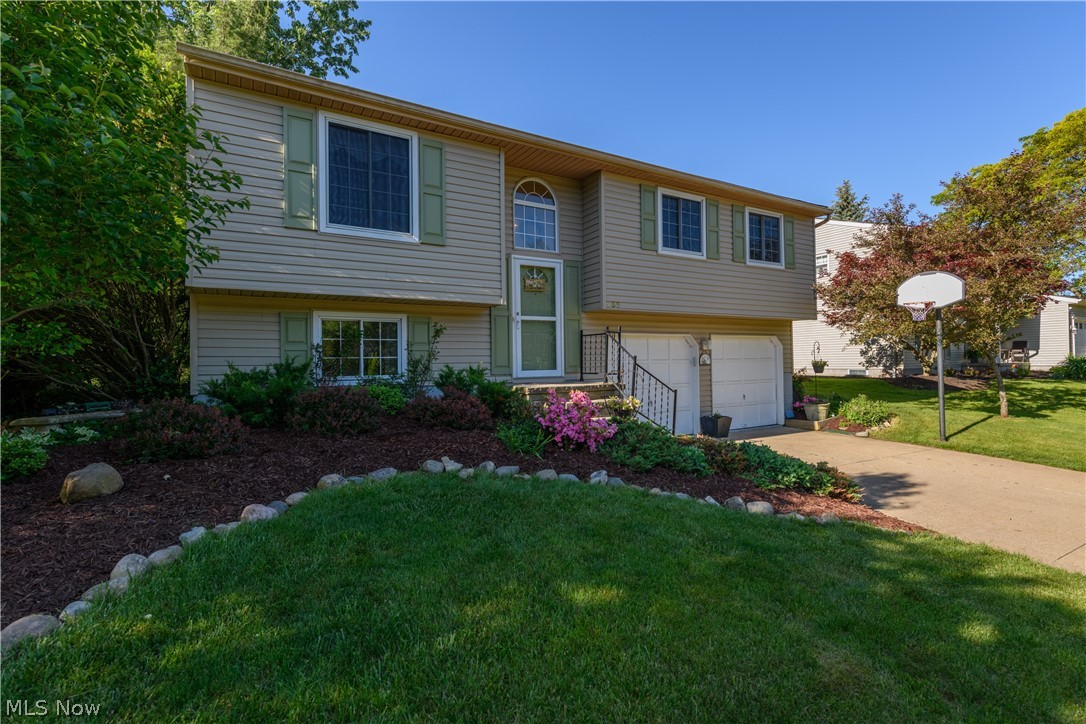 Welcome to 952 Oakbrooke! This stand-out home is light, bright, & move-in ready! Greet your guests in the foyer with it’s large, arched window (so unique for a bilevel!) The main floor is beautifully neutral and ready for your own personal style. The cheerful kitchen overlooks the lush backyard with brand new vinyl floors, and new oven (2018), new dishwasher (2019), and new refrigerator (2019)! The dining area invites you to stay a while, with a tree top views of the deck and expansive backyard. Finished lower level has room for entertaining, an additional half bath, and a bright laundry space. The garage is ready for all your storage needs. Savor your summer on the vacation-like, covered deck or on the sun splashed patio surrounded by hydrangeas, lilacs, and daisies. This house shines with welcoming warmth! Additional updates include: newer furnace (2013), hot water tank (2013), air conditioning (~2014), vinyl siding (2014). Live your best Medina life, located minutes from the sq