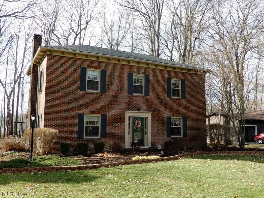 Rare opportunity to own a piece of history! The Orrin Burdick Farmhouse was built circa 1845, and was moved to it's current location in 1987. Charming all brick colonial offers the character and quality of the past and modern comforts of the present. Spacious floor plan features a gourmet kitchen with breakfast area, formal dining room, formal living room w/fireplace, and a first floor office. Second floor offers 4 generously sized bedrooms w/ample closet space and an updated full bath. Enjoy the spacious 2 car garage, full basement, and entertain on the covered patio - all on a scenic wooded lot! The upgrades are both numerous and high quality! Kitchen remodeled 2005, Timberlake cherry cabinets (w/under cabinet lighting), granite counters, maple hardwood flooring, stainless appliances, stainless double bowl/fixtures, ceiling fan, gas line and logs to cooking fireplace! Electric 2005 (200 amp service), water softener system 2016, hot water tank 2016, re-insulated attic 2016, Pella wind