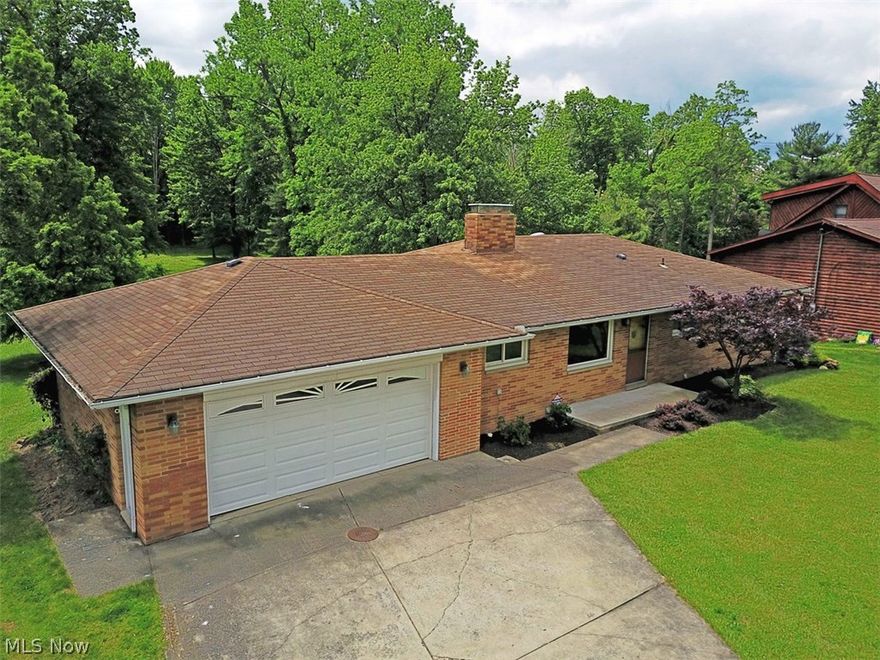 This all brick ranch, is just the property you have been searching for. With a beautiful lot that is just under 1.75 acres, this house overlooks a small creek with the property that leads up to a wooded hill, then to a large plateaued green space. Inside, there is a remodeled kitchen and dining space with Amish built maple cabinetry, updated appliances and quartz counter tops. The main floor is predominantly hardwood flooring with a living room consisting of a fireplace and a new Pella glass sliding door that leads out to an elevated deck. Windows have been upgraded by Renewal by Anderson. The main bath was just remodeled with gorgeous tile, large vanity and a granite counter. The walk-out basement, with fireplace, gives plenty of additional living space with a sliding door that leads out to a patio. There is an additional full bath as well. The exterior foundation was fully excavated and waterproofed consisting of replacement drain tile and properly backfilled gravel, in 2014. This ho