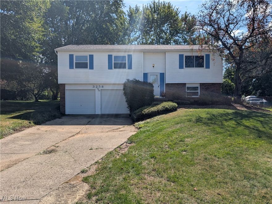Welcome to this bright and beautiful split-level 3 bed, 2.5 bath home in Brunswick! It perfectly blends comfort and modern updates. The main level showcases an open-concept design with rich hardwood floors flowing throughout the living and dining areas. The contemporary kitchen features granite countertops, classic wood cabinetry, and a center island, making it the heart of the home. A sliding glass door leads directly to the expansive raised deck, offering a seamless transition to the lovely, private, and tree-shaded backyard. The interior also features a clean, neutral color palette, a convenient walk-in pantry, and an updated bathroom with a dark-wood vanity.

The home offers a practical side with a lower-level two-car garage space. This area is already equipped with robust storage shelving and utility space, offering great potential for a future workshop or simply exceptional organization. With excellent indoor living space and a large deck for outdoor enjoyment, this home is move-in ready and waiting for you!

Recent updates: Roof (2020), Gutter Leaf Filters (2023), Disposal and Dishwasher (2025)