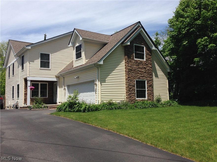 Welcome to 15 E. Summit Street, Chagrin Falls. This home is very unique and may be just perfect for you! Step up to the sweet front porch, and enter the cozy open living room, dining area and kitchen that greets friends and family. The chef will LOVE this kitchen with stainless appliances, quartz and plenty of cabinets.The sliding glass door exits to the Trex deck and brings in plenty of natural sunlight. Three bedrooms and a full bath complete the first floor.  The second floor has adjacent dual master suites with luxurious 5'x5' adjoining shower, accessible from both suites. One master bedroom has an en-suite bathroom with the other master en-suite including a vanity and jetted jacuzzi tub. Each master bedroom has a vaulted ceiling and large walk-in closet. The second floor also includes a 1/2 bath, family room and a bonus room that could be used for a fitness studio, office OR additional living space for guests.This room is above the 2 1/2 car heated garage. This home also includes