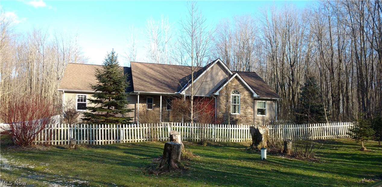 Custom built 3 bedrm, 2 bath ranch w/full bsmt in 2003/fireplace in family room/house generator if electric goes out/master bath doorway made wide enough for wheelchair access. Current access to garage is thru the garage/Walk-out sliders from the fam rm to a large deck overlooking wooded views/Loads of hickory cabinets in kitchen with a planning desk and all appliances/large 32 x 34 out bldg used for lawn equipment but could be for additional cars/solid oak 6 panel doors thruout/Heat pump plus an electric furnace/New HW tank in 2014 and new gutter helmets in 2015/Security system/House is wired for the generator/Big Creek Park and hiking trails are directly across the street/a great place for peace and privacy to call home - beautiful 14 acres of contentment. Interior professional photos to be taken.