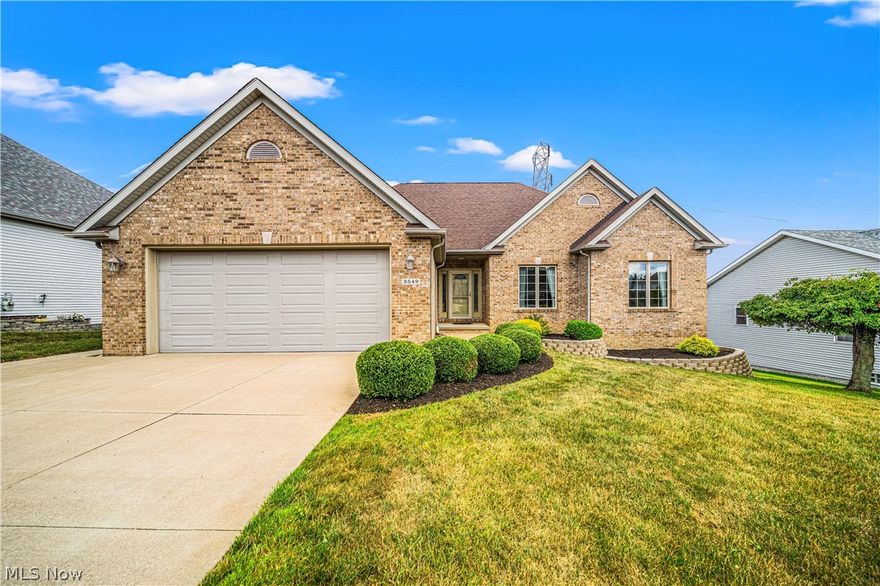 Welcome to this beautiful open concept raised ranch home with finished lower level apartment/in-law suite. Ready for you to move right in, the home offers plenty of natural light. Enter the foyer and take in the beautiful 3/4" hardwood floors and natural wood trim leading to the vaulted great room with raised hearth brick fireplace and gas logs. The great room connects to the kitchen with a large island that has the range and counter seating. The dining area with vaulted ceiling and wall of windows has a slider that opens to the upper level deck, perfect for relaxing or entertaining with family and friends. To the left off the foyer is a hallway leading to the master bedroom with ensuite bath and walk-in shower. The walk-in closet houses a safe. To the right of the foyer is the office with french doors and the hall leading to the second bedroom and full bath. A half bath and laundry with folding area complete the single floor living. The amazing lower level is perfect as an in-law suite or apartment and features a full kitchen with counter seating, a living area with a second gas raised hearth brick fireplace, a bedroom and full bath. A slider opens to the concrete patio overlooking the large back yard. You will appreciate the large workshop with an additional storage area that completes the lower level. Outside, the upper deck has a gutter system and gas line for a grill or fire pit. Make many memories in this amazing home! An America's Preferred Home Warranty is provided for buyer's peace of mind.