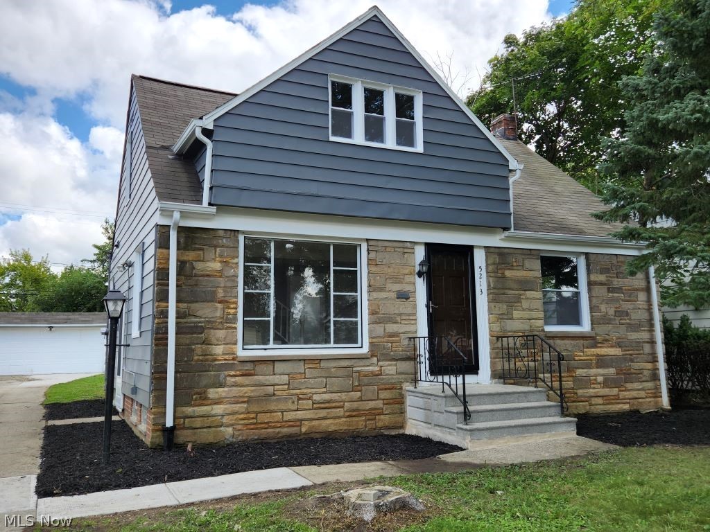 Come view this stone faced professionally rehabbed masterpiece. Everything that was completed was done w/ quality. The moment you enter you will see this w/ new gleaming wood flrs, & newly added recessed lights along w/ a huge picture window & built-ins. Continuing to the right you will find 2 large BRs w/ brand new carpet & hardwood flrs under the carpet (one has door to rear patio) & a full bath w/ tile flooring & tub surround & a new vanity & sink. Coming back down the hall you will enter the expansive kit w/ tile flr & over the counter lighting & new white cabinets, tile backsplash, sink, counter, & recessed lights (appliances are available if buyer likes). The upper level is a suite that has all new carpet (wood flrs under carpet) & can be used as a mstr BR or teen area & features a nice sized BR w/ walk in closet w/ built-ins & an adjoining bonus rm w/ exposed brick wall that would be perfect as a sitting/exercise rm or office. The lower level has a finished area w/ new luxury vi