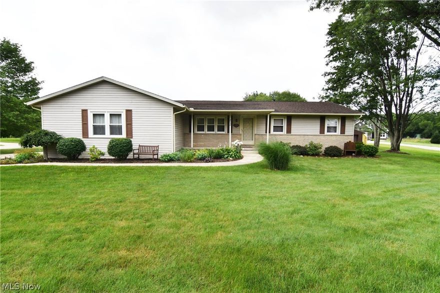 2732 Graybill Rd in Green LSD, just under an acre corner lot, you will find a ranch style home and a 20 x 42 - four car garage/outbuilding with a cement floor, water, electric and newer man door, plenty of storage, workbench and set up to home security system. The home offers three bedrooms, one full main bathroom with access to master bedroom and a half bath just off family room w/ gas fireplace, kitchen and as you come in from the large attached two car garage w/ H&C water. Throughout the home custom solid oak doors, trim/woodwork and cabinetry w/ updated handles. The kitchen offers Quartz counters (Hartville Hardware), tile backsplash, newer appliances, ceramic tile flooring (in kitchen, dining area, bathrooms & hall from garage). The dining area opens to a low maintenance Trex deck overlooking the backyard. A spacious living room in the front of the home just off from kitchen. A full twelve coarse basement with glass block windows, workspace/bench & storage. Updates- AC 2018, sump