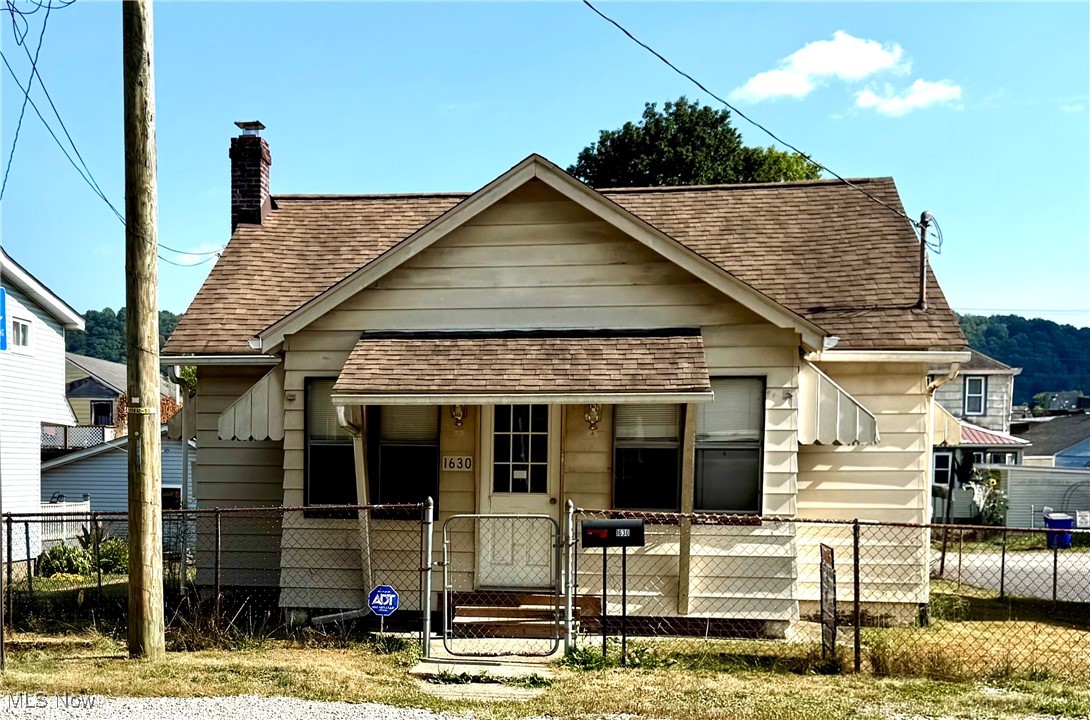 First home? Downsizing? Looking for an investment opportunity? There’s potential in this solid and affordable 2-3 bedroom, 1-bath bungalow. A little paint and imagination is all it takes! With an enclosed front porch/seasonal room, an open layout of living room and kitchen area, it holds promise for the next new owner. The home is an excellent option to make personalized cosmetic updates tailored to new owners style, as the major components have been updated for you! The home features 2 bedrooms on main floor. The smaller of the 2 bedrooms was converted to a 1st floor laundry for convenience, but laundry could be relocated to the full basement, if you desire to use it as a 2nd bedroom or home office. The 2nd floor has plenty of room for a 3rd bedroom, awaiting to be finished or used for extra storage. An updated 1st floor full bath includes ADA features. The easy to care for yard, has a chain link fence and is simple to maintain. Open back porch off kitchen for access to yard, garage & alley. 1 stall detached block garage. Situated in the East End location of East Liverpool with an easy commute to PA/Ohio/WV state lines & Routes 11, 7, 22/30! Home being sold AS-IS.