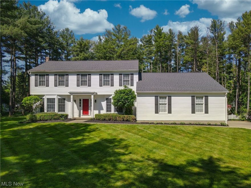 Check out this stunning home!!! Located on the North side of Hudson, minutes from Hudson Country Club, all the Hudson schools and downtown Hudson.  Enter through the front door and head into the oversized living room with tons of natural light.  The kitchen has been updated with white cabinets and a center island with Corian countertops. Off the back is a 2-story addition and leads out to the patio with views of your private backyard. The family room is open to the kitchen and has built in storage and bookshelves flanking the gas fireplace. Laundry room is off the mudroom which has access to the oversized 2-car garage.  A formal dining room and powder room complete the first floor.  Upstairs the primary suite has a huge bathroom with a soaking tub, double vanities and large tiled shower. The hall bathroom is updated with a subway tiled shower and great black and white flooring. One bedroom has access to the addition which makes it 2 rooms in 1- Great for a teen suite or siblings to sha