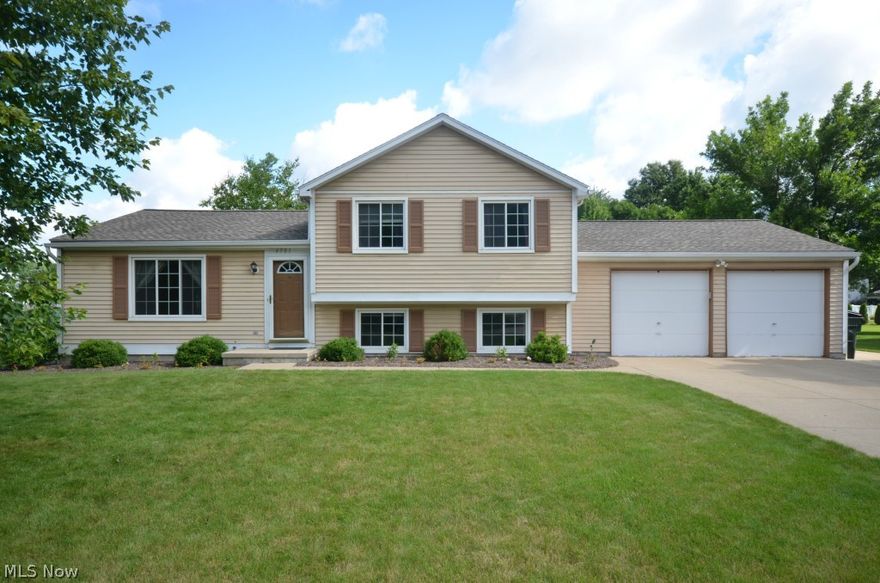 Incredible opportunity in Green Meadows Estates! Move in condition 4 Level Split w tons of updates. Foyer entry w coat closet & main level open layout living rm w lg window, dining rm w slider out back and kitchen w wood laminate floor & stone back splash. Great 2 tier deck w privacy, brick patio, raised garden beds & spacious back yard w charcoal grill- nearly ½ acre! Lower level features lg family rm w tons of daylight, stone wall w Amish built electric fireplace & new (’11) full bth w solid surface shower, flooring, commode, fixtures, vanity, solid surface counter & undermount sink. Giant storage closet off fam rm & mud rm entrance off of garage. Basement features partially finished rec rm w big closet plus unfinished storage/util/laundry area w sink. Upstairs Updated full bth w shower/tub, master bdrm w walk in closet & addtl bed w closet organizers. Updates include: ’11 Partially finished bsmt, Remodel LL Bath, Amish Fireplace & surround. ’09 Dimensional Shingle roof, Well tank &