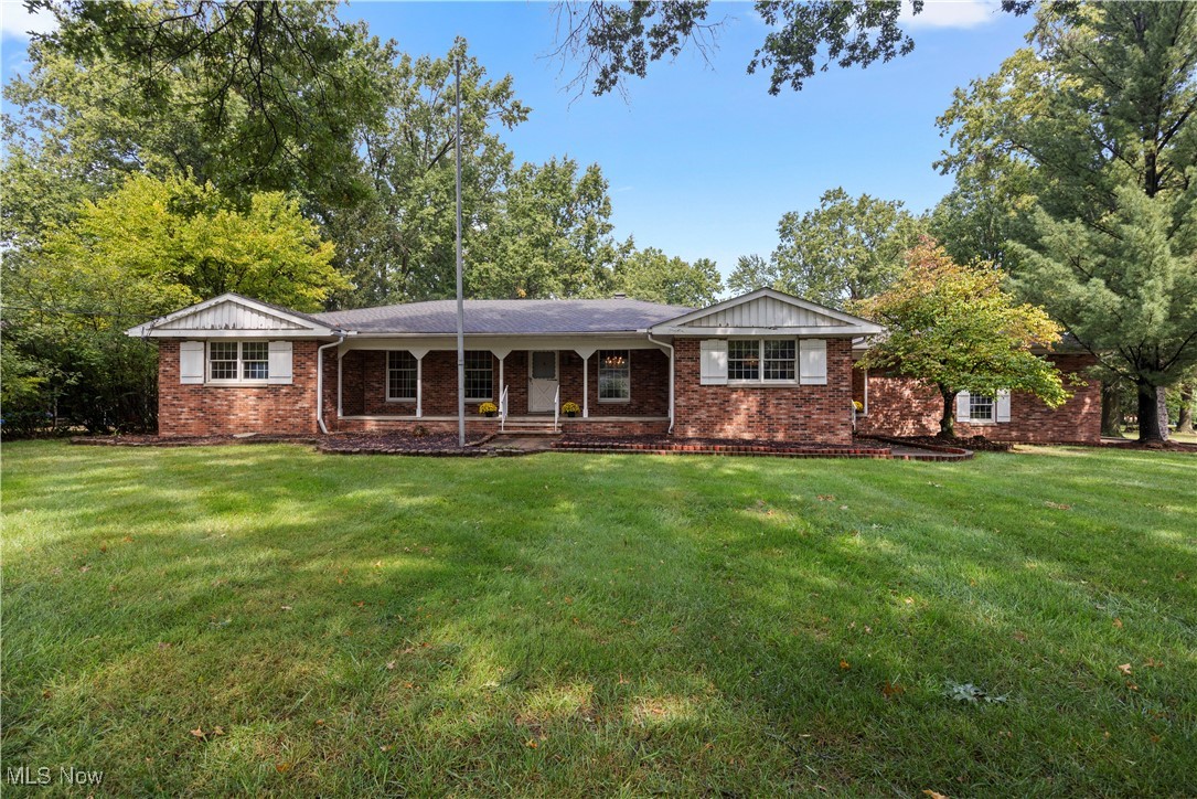 Welcome Home to this Spacious 4 Bedroom Ranch nestled on almost .90 Acre Lot! The Large
In-Eat Kitchen offers Granite Countertops & Hardwood Floors with All Appliances to Stay! The
Stove is tucked into a Brick Alcove too! The Dining Room can fit a Good Sized Dining Table,
Chairs and Buffet with Plenty of room to spare! Directly across is the Cozy Living Room too!
Step over to the Wonderful Family Room with Beamed Ceilings, Built-In Bookcases and a
Woodburning Fireplace for those Cold nights to come! The Family Room opens to the 3 Season
Sun Room which overlooks the Beautiful Large Backyard with a Concrete Patio too! This area is
a Great Spot for Summertime Relaxing and Entertaining! As you walk down the Hall you will see
3 Bedrooms all with Wood Flooring! The 4th is the Master Bedroom with an En Suite
Bathroom! There is another Full Bath with Double Sinks for the other 3 Bedrooms to utilize as
well! Stepping down to the Basement you will see a Room with the 2nd Wood Burning
Fireplace, an Enormous Rec Room and a Large Bar/Game Room Area also! The Bar offers a
Sink, lots of Shelves and more! There is an additional Kitchen and a 3rd Full Bath in the
Basement too! The Oversized Laundry Room can accommodate all your Cleaning & Extra
storage needs! In addition, there is a Cold Room with Running Water that owners had
previously used to make and cure Homemade Sausage! AC - 2016 and Hot Water Tank - 2012!
Roof had a Total Tear Off in 2008! Additionally, there is an Extra Large 2 Car Garage which
includes Expanded Driveway Parking Spaces! Including the Finished Basement, this home
offers over 5,000 square feet of Living Space! Come & Experience All this Home has to Offer!