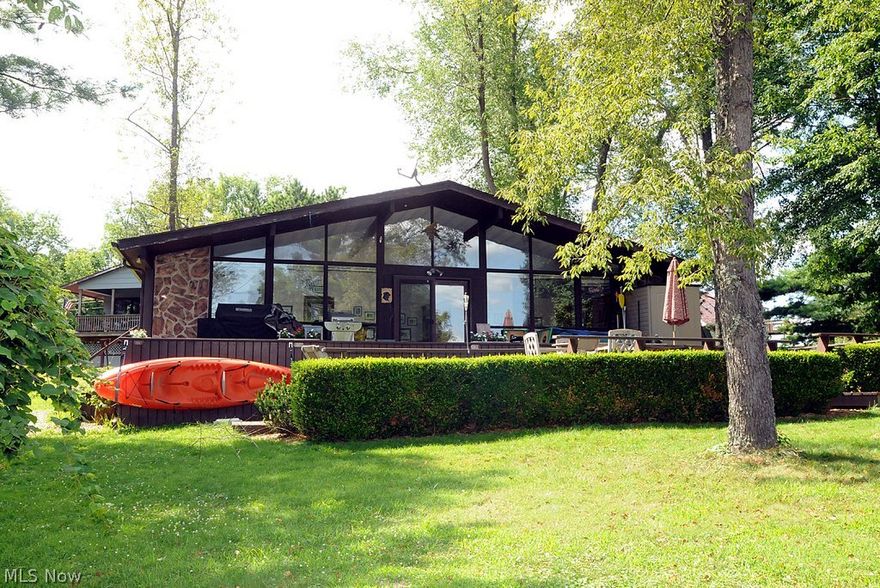 Set sail for Seneca Lake and get your weekend retreat. This 3 bedroom Bungalow is looking for a new owner. You'll love the wall of glass merging the indoors and outdoors together. The 700+ sq. ft. tiered deck make this the perfect place for outdoor entertaining and the spacious lot provides plenty of room for a game of corn hole after a fun day on the lake. Dock includes space for 2 jet skis. MWCD annual lease is $1,608.
