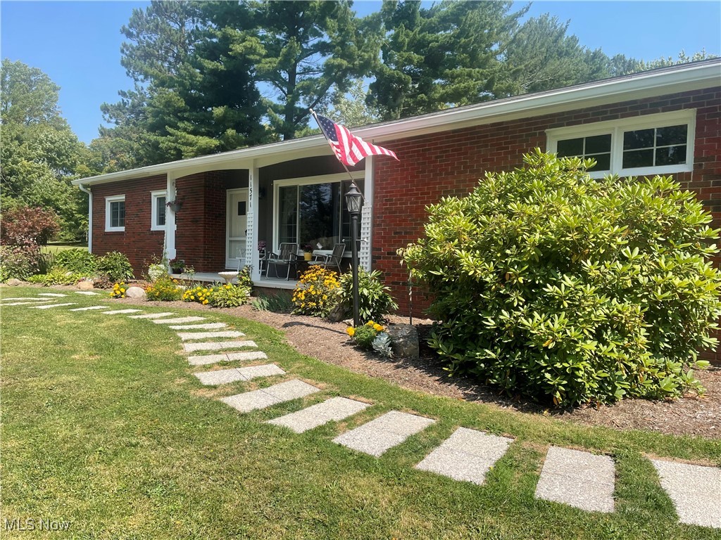 Wonderful opportunity to live in the Bass Lake Community of Munson Township. Just up the road from the Bass Lake Lodge and Preserve. Solid three bedroom, two full bath brick ranch home with a full basement and storage galore. First floor features a spacious living room with a large picture window overlooking the front yard. Cozy Woodburning fireplace insert in the family room - perfect for those chilly Ohio winters. Higher efficiency windows throughout the home and a large sliding door allowing plenty of natural light giving a wonderful view of the pretty back yard. Hardwood floors and ceiling fans in the bedrooms. New range/oven and refrigerator just installed August 2025. New gutters and downspouts installed in 2025. First floor mud room off the attached garage has plumbing in place for installing a first floor laundry. The driveway is built with brick pavers. Situated on a beautifully landscaped and pictureque one and a half acre lot with raised garden beds and multiple fruit trees. (see attached documents for list of plants/trees). Full basement features glass block windows and separate rooms for workshop, recreation room or even an extra bedroom. Transferable basement warranty from Ohio State Waterproofing. Bass Lake Community membership is optional to join. Be sure to check out the beautiful Bass Lake and Lodge at the end of the street. Don't miss out on this exceptional home and community.