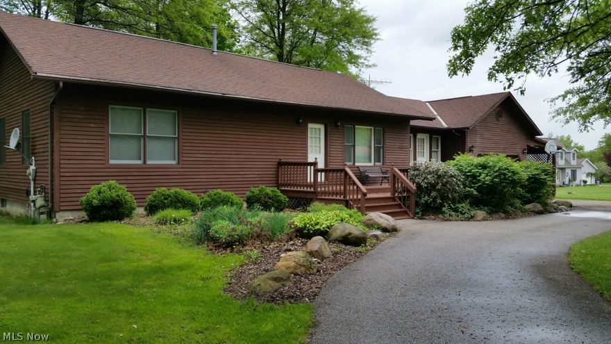 Classic ranch with open floor plan located on nice side street in Middlefield Village.  Pine vaulted and beamed ceilings add to the warm welcoming feeling you get upon entering.  Kitchen has a grill cook top range and plenty of counter space.  The family room is also vaulted and has a gas log stove for a nice source of heat and ambiance.  The washer and dryer are on the main floor in the hallway leading to the bedrooms.  The master bedroom has a full bath with walk in shower.  Nice open basement ready for anything! Attached garage, carport, and 24x20 pole barn to store all your stuff.  A horseshoe drive complete the package!