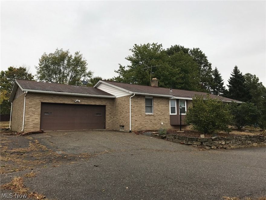 Here's your chance for your own hidden gem tucked away at the end of Elm St in Orrville. Spacious 4 bedroom, 3 bath brick ranch on little over an acre.
The Master bedroom is very spacious and has a gas fireplace and a Master Bathroom.  There is another bedroom and full bath located on the main floor.  Enjoy the spacious kitchen with plenty of counter space.  There is an informal eating area and also a Formal Dining room.  The lower level features 2 more bedrooms and a full bath with a opened finished area that would make a nice game room, or family room.  Spend your evenings out on the deck enjoying the mature trees and wildlife.   A little work is needed but a lovely spot to call home with plenty of room inside and out.  Property is sold AS-IS, seller makes no representations or warranties.