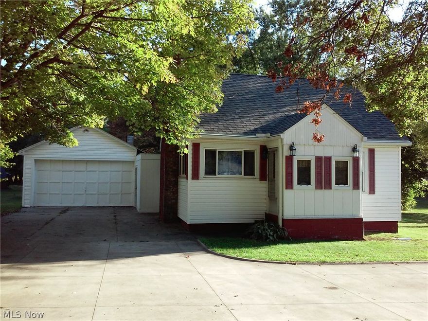 This cute little cape has so many options for use. It has hardwood floors throughout the main floor living space, a cute as a button kitchen with amazing use of space for cabinetry. There are storage nooks galore! The fresh painted full basement is home for washer and dryer that will stay and a titled full bath with shower. The huge 4+ car attached garage could be your home heated workshop. There is a 16x12 potting shed with concrete floor and windows for air flow and in the rear of the property an enormous 34x36 two story gable roof garage with full electric service, perfect for motor home storage, home business, or whatever you may need. All buildings located on the property were just roofed in 2012 and were complete tear offs. Hot water tank, new vinyl siding done in 2012.