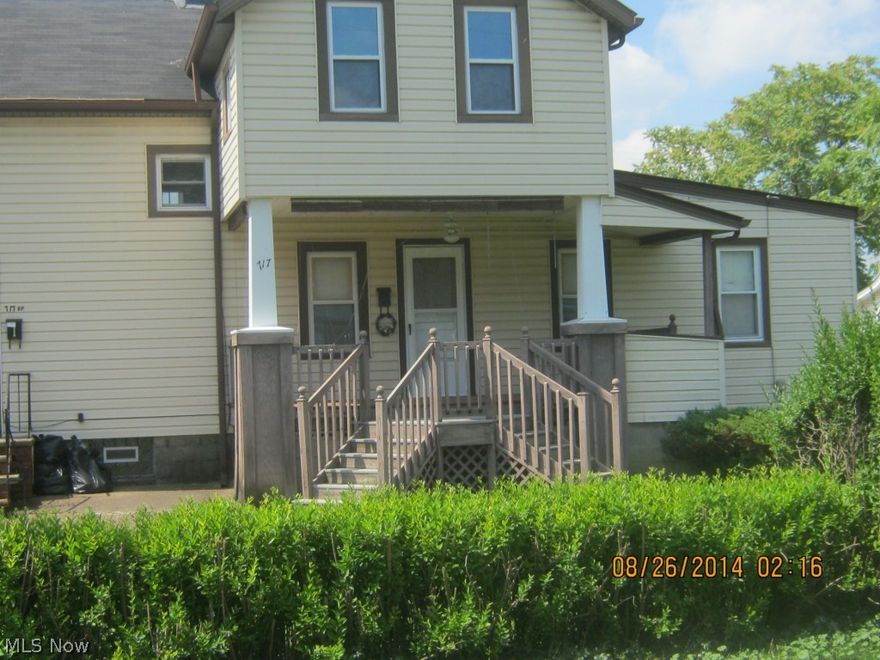 Priced to move 2 family and yes a 4 car garage.  See this before its sold.  2 bedrooms each unit.  Seeing is believing.  Income property let the tenants make your payments.  Apartment 1 has 5 rooms-2 bedrooms.  Apartment 2 has 4 rooms-2 bedrooms.  Sold "AS IS"