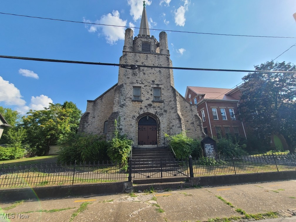 Exterior stone architecture, sanctuary features beautiful woodwork and stained glass windows. Basement features offices, fellowship hall, 2 restrooms. Ample parking.