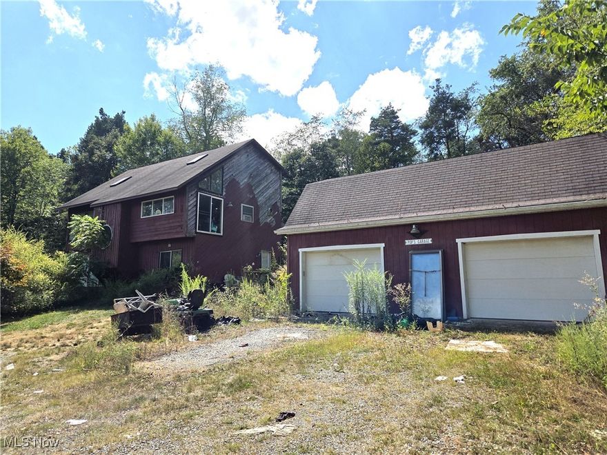 Selling as-is, seller to make no repairs. Discover the possibilities with this 3-bedroom, 2-bathroom home nestled on a private 18.65-acre property. Whether you’re seeking a peaceful getaway or a place to create your dream homestead, this property has so much to offer.

Inside, you’ll find a unique layout featuring an eat-in kitchen, living room, den, and a versatile flex space that could serve as an office or even a 4th bedroom. While the home is in need of updates and repairs, it offers the opportunity to customize and make it your own.

Step outside and enjoy the sweeping views, open cleared areas, and wooded acreage that provide the perfect blend of space and seclusion. The oversized 2-car garage includes a barn-style loft, ideal for storage or a creative workshop. Additionally, the property features a second dwelling—a fixer-upper or tear-down mobile home, offering investment or multi-generational living potential.

With abundant land, privacy, and room to grow, this property is a rare find for those looking to create their own vision in a serene setting.