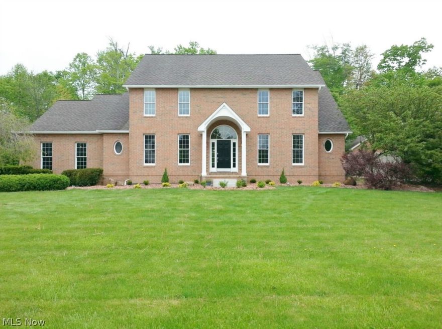 Brick and vinyl 2 story, 5 bedrooms, 3 1/2 baths on a private wooded lot with first floor Master bedroom. formal living room and dining room, 2 story foyer, with open staircase and balcony overlooking the 2 story brick fireplace in the family room. New kitchen, cabinets, granite counter tops, new appliances, large dinette area with French doors leading to an Olympic size in ground pool with vinyl fence. Master bath with Jacuzzi and tiled shower. 1 st floor laundry, 3 car garage.