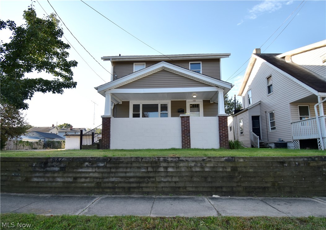 Welcome to 682 Hollibaugh Ave in Akron! This 3 bedroom, 2 full bath colonial boasts over 1,500 square feet of living space and features a fenced in backyard, newer furnace, HWT, siding, flooring, updated bathrooms and a ventless gas fireplace. Roof on the house and the a/c unit are both about 15 years old. Fresh paint throughout declares this home move-in ready! You'll find both a covered front porch and a back deck for you to enjoy time outside with friends and family. This triple lot also features a detached 3 car garage. Laundry and second full bath on lower level. Home located on a quiet dead end street while still being close to multiple parks and entertainment areas. Don't miss your opportunity to own this home. Schedule your private viewing today!