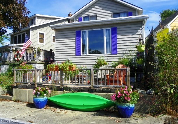 Adorable lakefront on main chain of Lakes with 2 bedrooms, 2 baths & updates* Great room with picture window overlooking lake, crown molding & updated slider with built in blinds to patio/deck* Dining room with wainscoting & updated windows* Kitchen with corian counter top, breakfast bar, tile back splash, refrig, range, dishwasher & disposal* Great room, dining & kitchen with laminate floor* Laundry & storage area (includes washer & dryer) off of kitchen with walk in cedar closet & glass block windows* Vaulted master with 2 sliding glass doors overlooking lake & walk in closet* Kitchen, bathrooms & hot water heater updated approx. 2009* Windows approx. 15 yrs. (except master)* Central air 2012 plus attic fan* Updated railing around patio/deck* Newer brick patio (lakeside)* Sea wall concrete walkway* Dock*