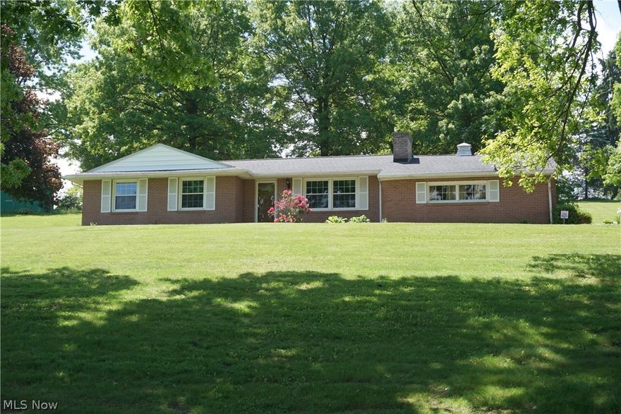 Rare opportunity to have 2.49 acres of country living in  Maplecrest Estates. This package has four parcels, wonderful all brick ranch with three bedrooms.  Two car garage with glaze tile walls, eat in area off of kitchen plus separate dining room with newer sliding glass door to back porch.  Spacious living room with wood burning fireplace. Electric forced air furnace (2019) , water softener (saltless) with green sand filter, heat pump with a/c (less than 10 years old). roof  (approx. 11 years old). Laminate flooring (2016), some windows, front door and sliding glass door (2015).  Make this your special place to call home.